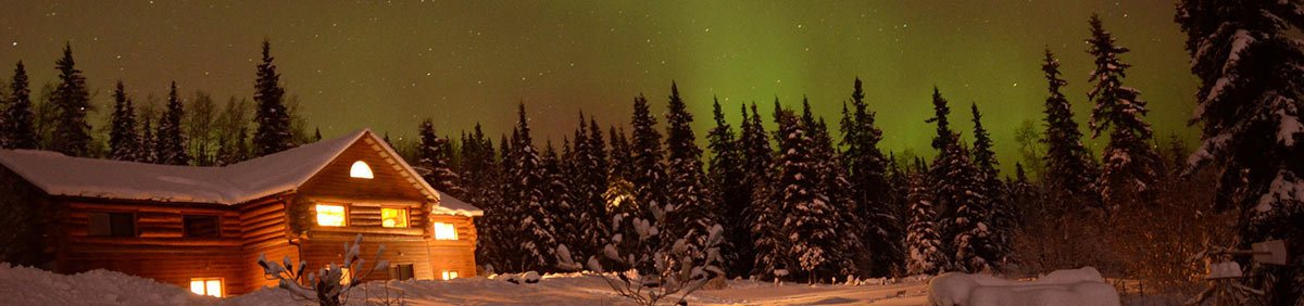 5 Best Places to See the Northern Lights in Alaska 5 Northern Lights and log cabin in Alaska night sky