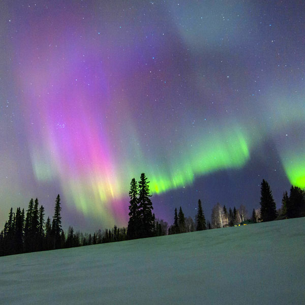 When & Where to See the Aurora Borealis 2 aurora borealis on an Alaskan hillside