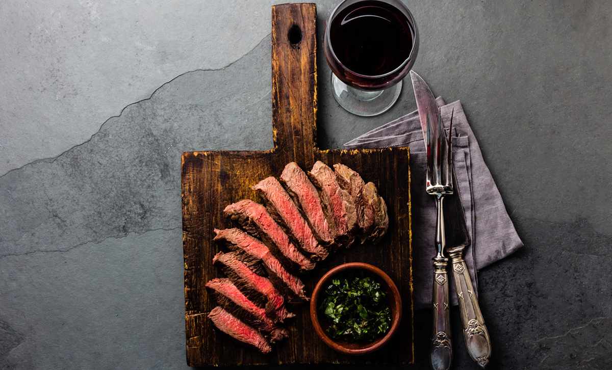 7 Reasons Argentina Is One of the Best Countries to Visit in South America 3 Slices of medium-rare steak, cooked Argentinian Asado style