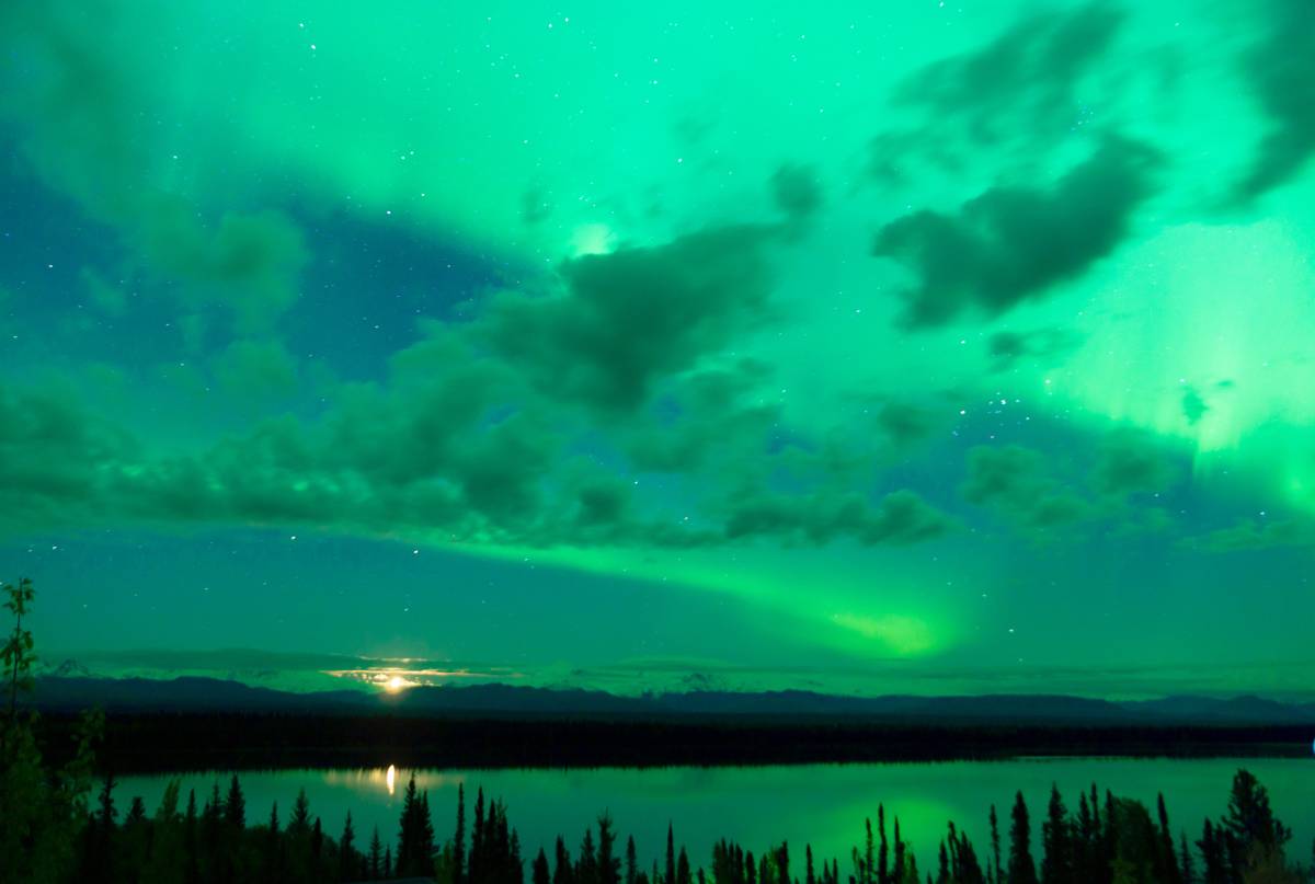 The Best Time to go to Alaska 3 The Aurora Borealis peeking through the clouds in Alaska