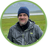 About Us 7 GuideImage Eric in Alaska grizzly