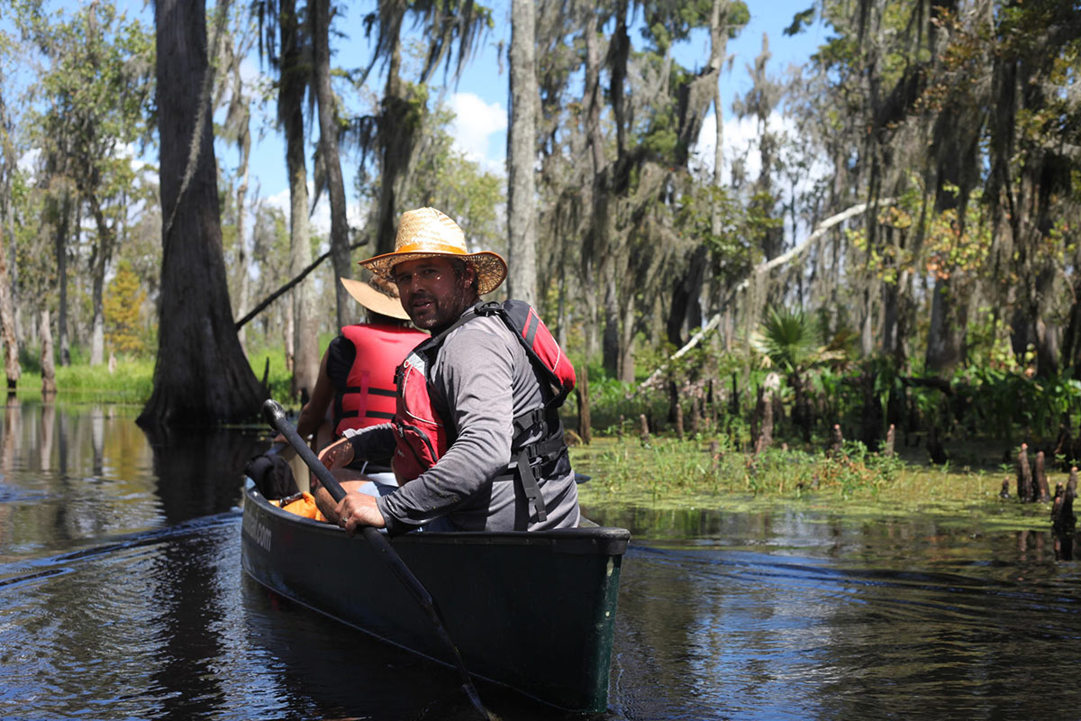 Carbon Neutral Tours and Vacations 4 Person kayaking in Lousisiana Bayou