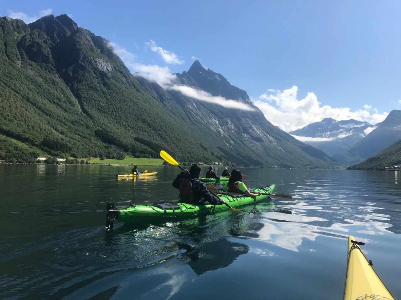 Experience the Western Fjords of Norway 2 People kayaking through the Western Fjords of Norway