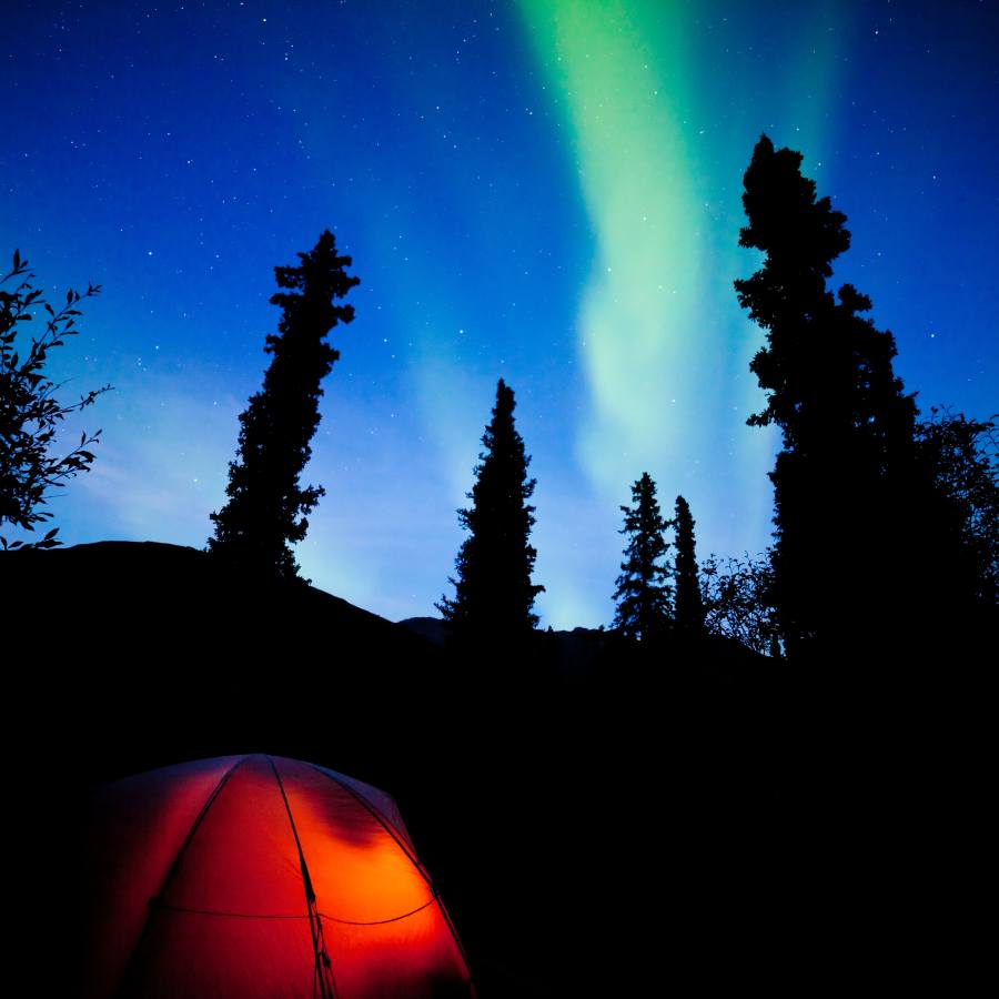 Increase Your Chances of Seeing The Northern Lights In North America 3 orange-taiga-tent-glow-under-northern-lights-flare